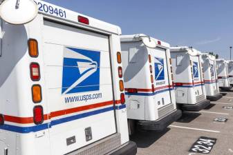 Postal service warning needed action, election official says