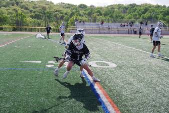 While in possession of the ball, Delaware Valley's Owen Kelly, #1, tries to outmaneuver a Vernon opponent.