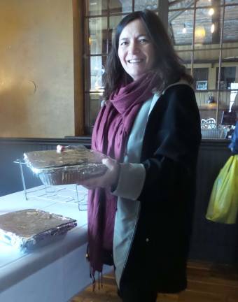 Cooks and tasters agree: Everybody wins Kim Hart delivers her chili con carne entry (Photo by Frances Ruth Harris)