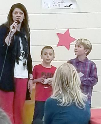 Kim Butaitis, Dingman-Delaware Primary School principal , and students deliver an appreciation address.