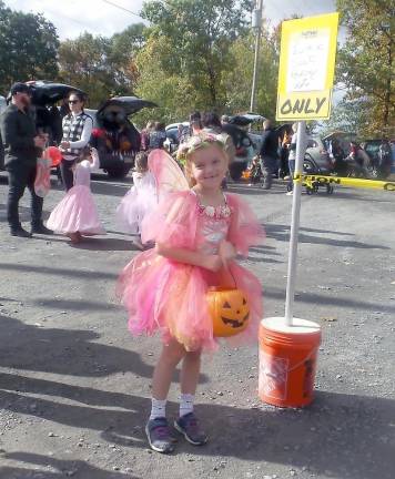 Fairy princesses mingle with ghastly ghouls at Trunk or Treat One little fairy charmed the scary creatures at Trunk or Treat (Photo by Frances Ruth Harris)