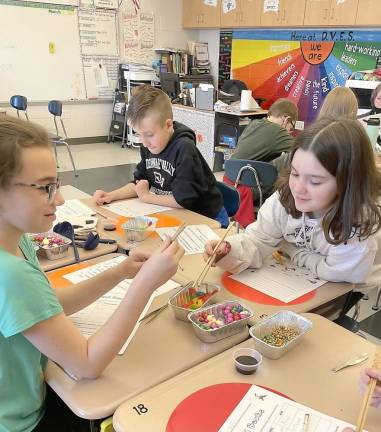 DVES students study animal adaptations Kylie Pevion, Liam Owens, Olivia Pitrelli (Photo by Peggy Snure)