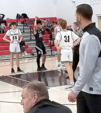 Players lined up for a foul shot in the varsity game