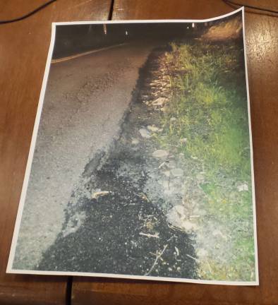 When roads stop being roads Patrick Mullins showed this photo to task force members of a disintegrating Sawkill Road. (Photo by Frances Ruth Harris)