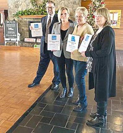 From left: William Schutte, executive vice president; Kimberly Gay, realtor; Kathy Louis, associate broker; and Carol Demarest, realtor