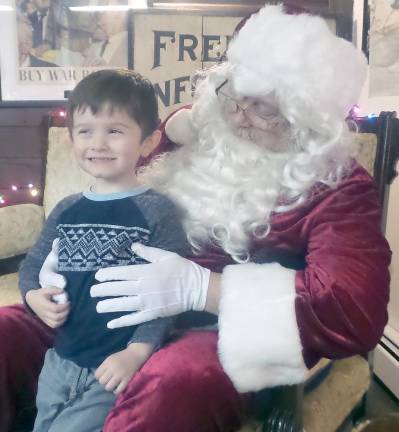 Wishes come true at 'An Old-Fashioned Milford Christmas' Owen Latini and Santa