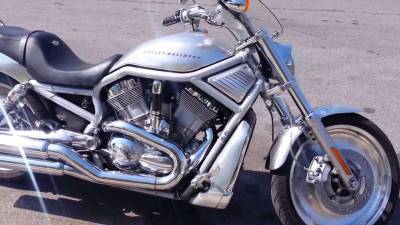 The missing bike is a silver 2003 Harley Davidson V-Rod, like the one pictured.