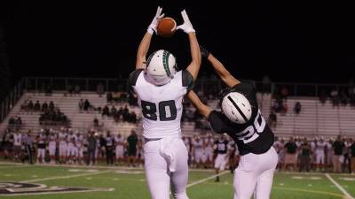 Pennridge receiver Connor Pleibel makes a leaping catch while covered by Delaware Valley defensive back Preston Machado in the fourth quarter. Pleibel was able to run and cross the goal line for a touchdown when Machado fell during the play. Pleibel produced 119 receiving yards.