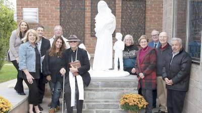 The Father Mullally Memorial Committee: Toni and Deacon Thomas Spataro, Karen and Ed Loeschorn, Kate Burns, Father Joseph Manarchuck, Rosemary Walsh, Carol and Ray Proulx, Jack Boyle, Deacon Mike Calafiore and Commissioner Matt Osterberg (absent from photo). (Photo by Thomas Duncan)