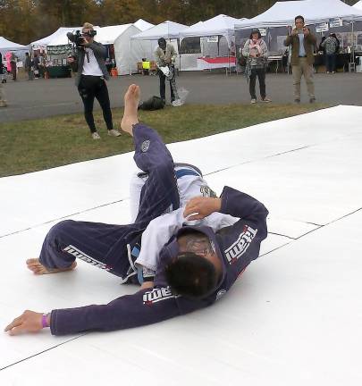 Gregg Gonzalas and Milton Menoscal demonstrate Brazilian jiu jitsu.