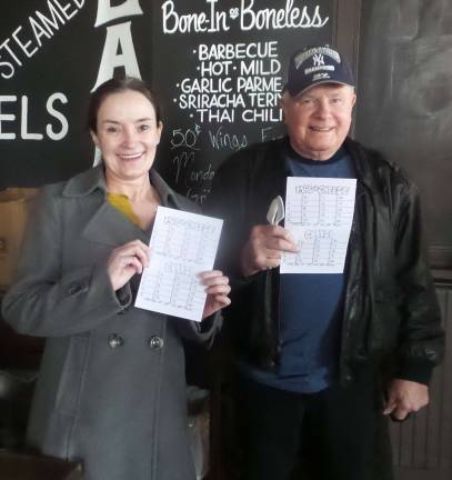 Cooks and tasters agree: Everybody wins Cheri and Richard Goghegan are set to vote on their favorites. (Photo by Frances Ruth Harris)