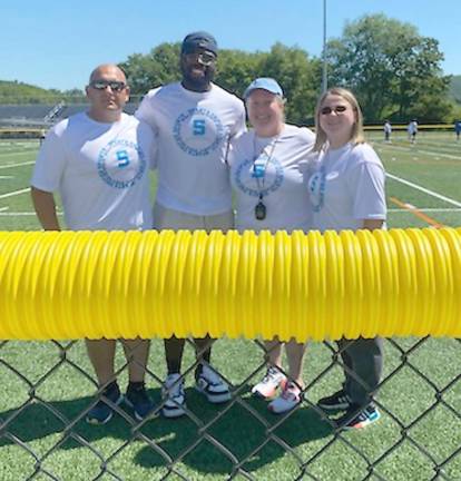 Unified Sports builds relationships on the field On the Sparta turf with the football team and Unified Sports (Photo by Laurie Gordon)