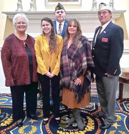 First row (from left): Guyette Calles, District Auxiliary President; Autumn Baker; Debra Baker; Rick Ellis, District Commander; second row: Gregory Protsko, Post 8612 Commander, Milford