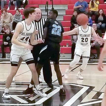 The opening jump ball in the varsity game was won by Jackson Shafer