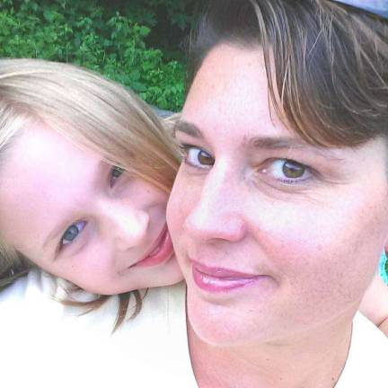 Mother Daughter Look A Like Contest Photo submitted by Sacha Dorsey of Glenwood Sacha and Caterina. "Hanging out with my sweet daughter while my son was in dance class."