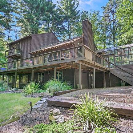 Contemporary lakefront retreat in a parklike setting