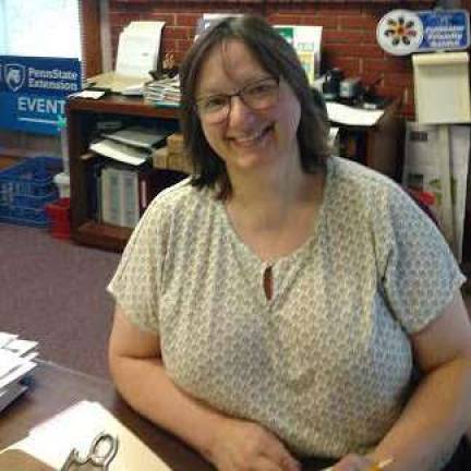 In Milford, Master Gardeners answer your questions Laura Orben, center administrator, takes calls at the Penn State Cooperative Extension office in Milford. (Photos by Anya Tikka)