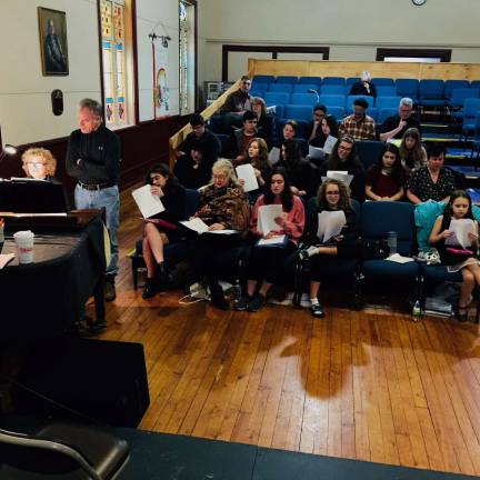 'Romantic Notions' is a musical celebration of love Sandy Salter at the piano and director Jeffrey Stocker (far left) are pictured rehearsing with cast members (Photo provided)
