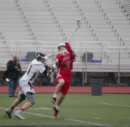 DV Warriors demolish North Pocono A Delaware Valley Warriior pounces on a North Pocono Trojan.