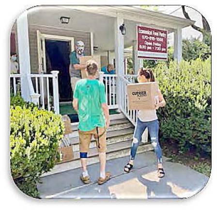 Volunteer Fabrisa Gallagher leads the “box brigade” (Photo provided)