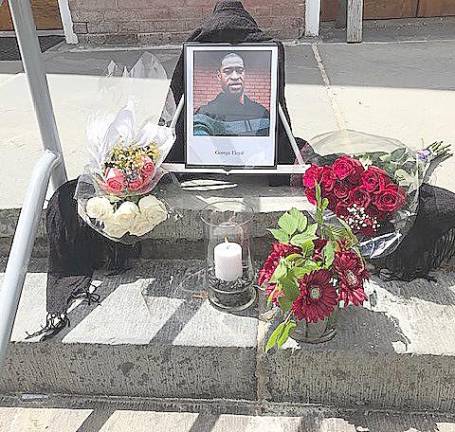 A memorial to George Floyd on the courthouse steps (Photo courtesy of Ed Gragert)