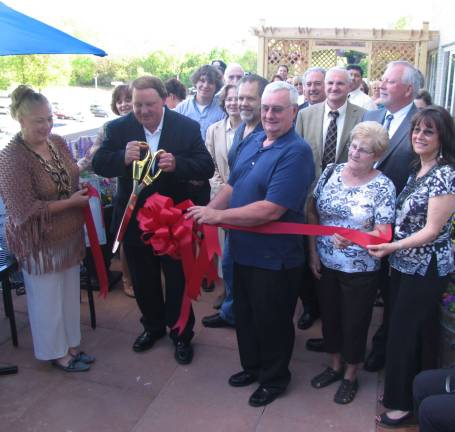 Healing Garden created at St. Joseph’s Place Dick McKeeby had the honor of cutting the ribbon. City of Port Jervis Mayor Russell Potter is to his left.