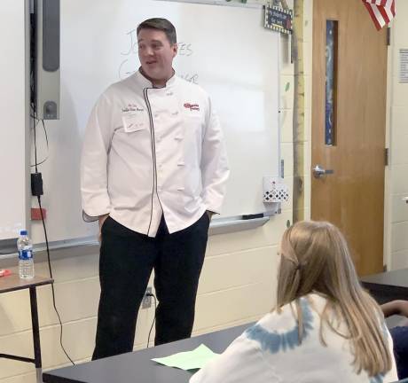 Eighth-graders learn from the pros about the world of work John Estes, restaurant general manager
