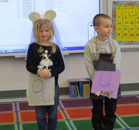 Kindergartners celebrate the union of 'Q' and 'U'! Bride Taryn Kaylor and Groom Conner Spangenburg, "Mr. and Mrs. Qu." (Photo by Peggy Snure)