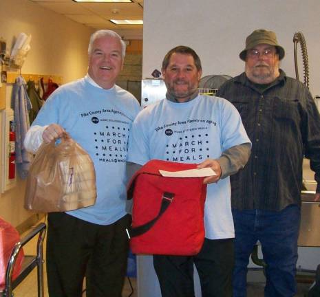 DDMS principal volunteers in March for Meals Photo provided From left are James Mitchell, DDMS principal; Robert Skibber, DDMS special education teacher; and Richard Wilhelm, home delivery meal transporter for the Pike County Area Agency on Aging.