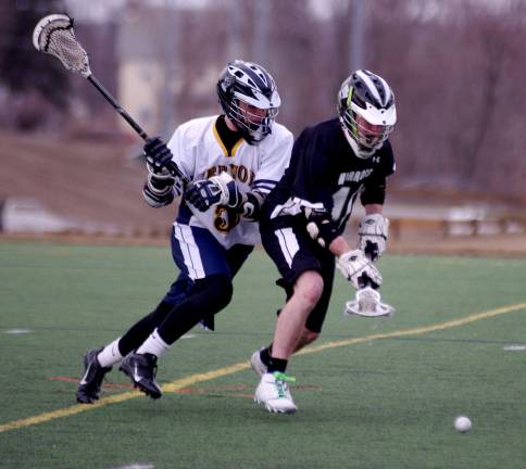 Delaware Valley lacrosse team loses to Vernon Vernon's Tom Modula and Delaware Valley's Jed Daniel chase after the ball.