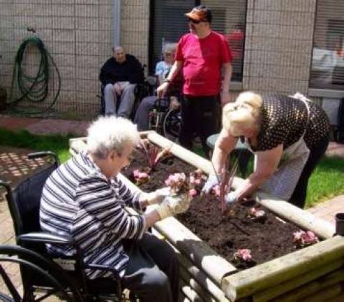 Home Depot volunteers lend green thumbs to Belle Reve Home Depot volunteers lend green thumbs to Belle Reve