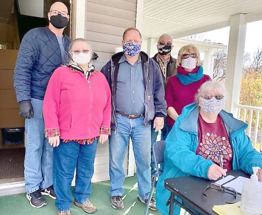 Food pantry volunteers (from left): Danny Bright, Clare Nied, Jay Holleran, Kurt (last name unknown), Sue Clayton, and Nancy Holleran (seated at the table) (Photo courtesy of the Pike County Ecumenical Food Pantry)