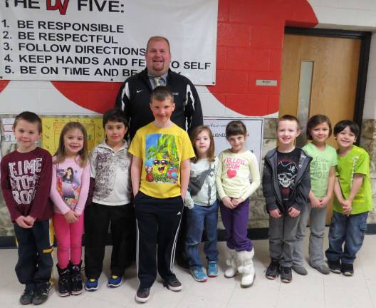 Celebrating Students of the Month First Grade Students of the Month: Jackson Miller, Kiera Mulzet, Anthony Paradiso, Jake Wallace, Mae Collier, Ariana Gesualdo, Colin Anderson, Audrey Martin, Nikolas Renna with DVES Principal Aaron Weston.
