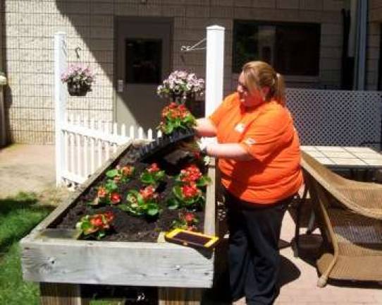 Home Depot volunteers lend green thumbs to Belle Reve Home Depot volunteers lend green thumbs to Belle Reve