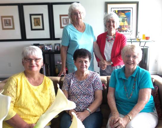 Denise Smithson (back, right), holding the hand of Bobby Stagg, greeted early arrivals: in the front row (from left): Joyce Van Ness, Gail Darcy, and Nancy Heim.