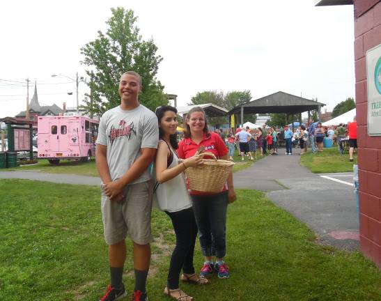 Dinner and fireworks kick off holiday weekend Recreation Center volunteers Skyler Phillips, Elena Lopez, and Brook Csenscits.
