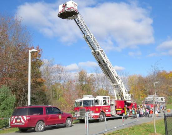 Firefighters demonstrate the ladder truck