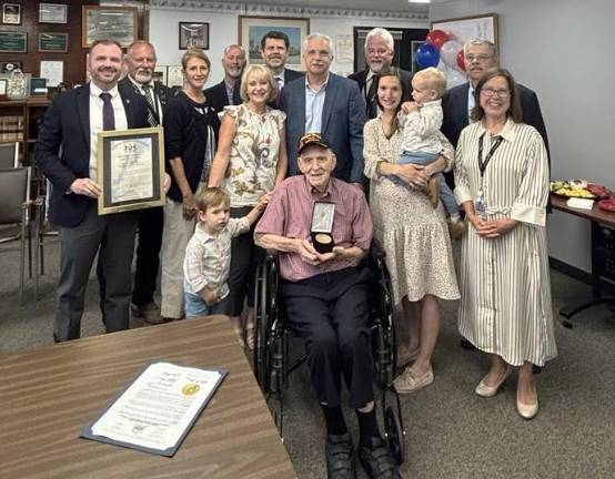 Medal, honors for WWII vet Sgt. Joseph Drake (seated) with (from left) Doug Miller, Brian Smith, Gina Ehrhardt, Brian Field, Ann Marie Drake, Rep. Jeff Olsommer, John Drake, Jim Shook, Laura Rotella, Tony Herzog and Jocely Cramer.