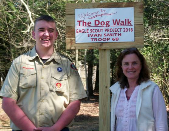 Eagle Scout candidate builds dog walk for humane society Eagle Scout candidate Evan Smith and shelter director Susan Beecher at the entrance to the newly created dog walk (Photo: E. Smith)