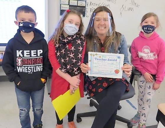 Winner of Pre-K-2nd Grade Category: Mrs. Anne Connell, 2nd Grade Teacher. Pictured (from left): Dominick DeLauro, Gia Cosentino, Mrs. Connell, and Hazel Pope (Photo by Peg Snure)