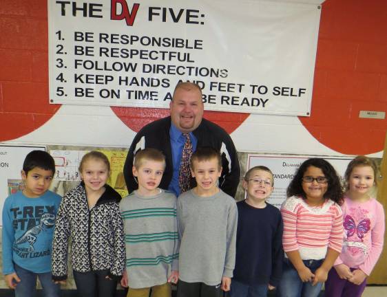 Top kids for January First Grade Students of the Month: Daeton Vazquez, Amanda Aragona, Tyler Lewis, Timothy Jason, James Mills, Lauren Whyte, Grace Stevens with DVES Principal Aaron Weston.