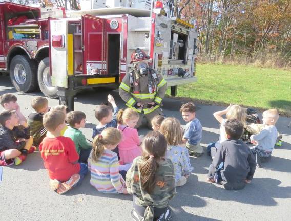 Matamoras firefighters give a safety lesson Mrs. Lawson’s kindergarten class with firefighter Lee Helms
