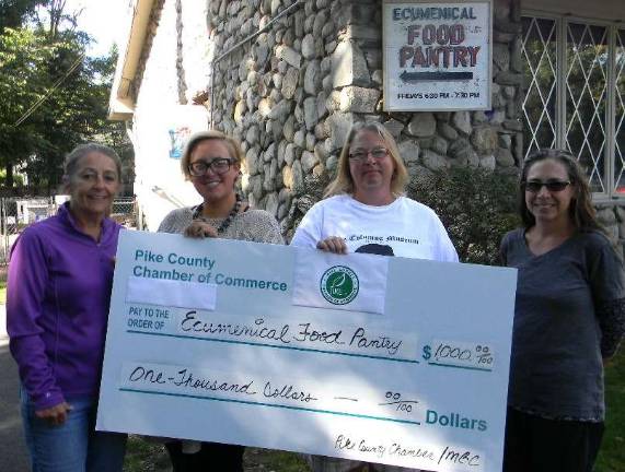Appreciation for food pantry bounty Adrianne Wendell, proprietor of Harrington House Bed and Breakfast; Amy Eisenberg, volunteer with Milford Business Council; Lori Strelecki, director of the Columns Museum/Pike County Historical Society; and Jennifer Carter, director of the Ecumenical Food Pantry.