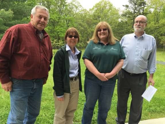 Bridge Preserve signs inspire interest in native plants From left: Dingman Supervisor Dennis Brink; Sally Corrigan, Pike County Conservation District; Karen Kleist, Dingman Township secretary/treasurer; and Tom Mincer, Dingman Supervisor (Photo by Marilyn Rosenthal)