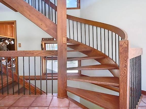 Mountaintop equestrian estate includes modern home and pond Staircase