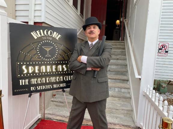 Boyle, the cop, at the Abba Dabba speakeasy entrance.