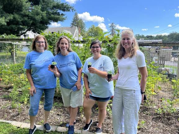 Local gardens win props for their crops at Kitchen Garden Tour Heaven Scent Community Garden’s volunteers. Photo by Lynn Costa.