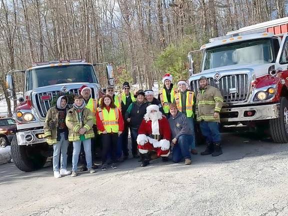 Santa to join Firefighting Elves on ‘Drive-By Holiday Safety Run’ Santa on his visit to Delaware Township last year. This year, the Firefighting Elves are keeping the traditional going with a twist (Delaware Township Volunteer Fire Company Facebook page)