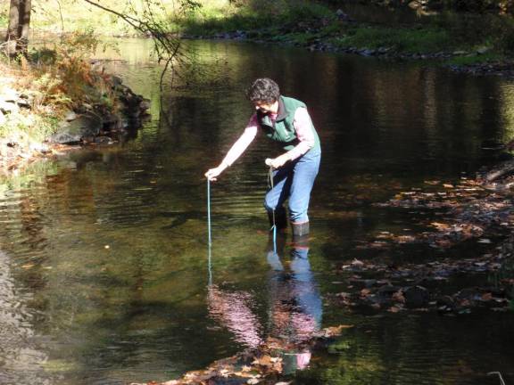 Wendy Lichty performs a test for the Streamwatch program.