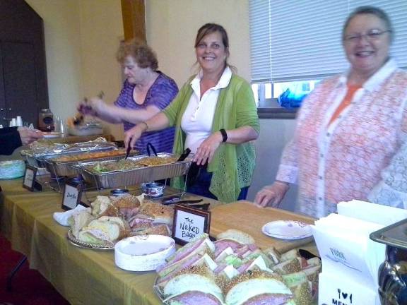 Milford Presents delivers bounty to food pantry Food pantry volunteers Nancy Potter, Liz Steen, and Clare Nied serve dinner from Milford’s many restaurants to a sold-out crowd (Photo provided)